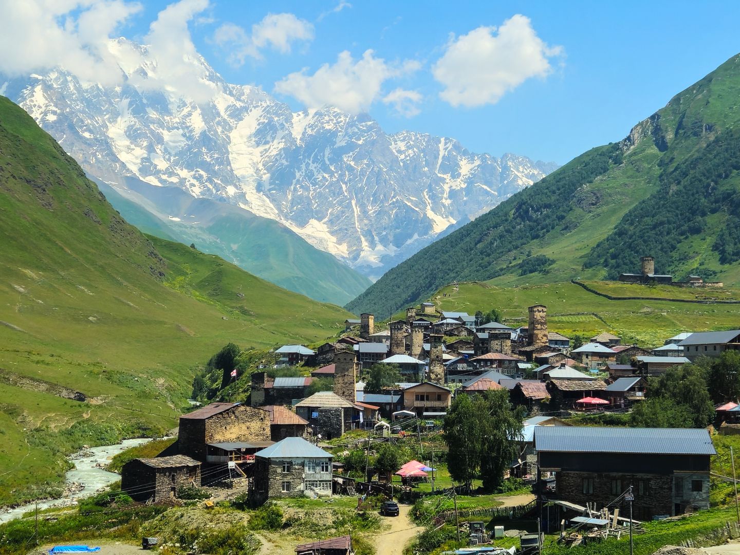 Scenic view of Ushguli village against the backdrop of the Caucasus Mountains in Georgia.